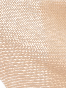 Macro view of the breathable beige honeycomb mesh knit fabric texture for women clothing