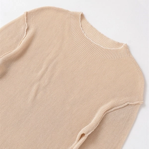 Elegant beige mock neck knit top for women with refined ribbed texture and minimalist style