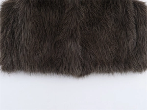 Close-up detail of plush faux fur texture on a dark brown fashion vest for women