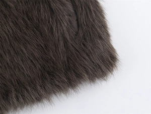 Detailed macro view of dark brown faux fur texture with soft thick long pile