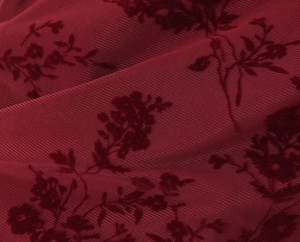 Detail of burgundy mesh fabric with exquisite velvet flocked floral patterns for dress
