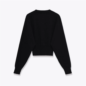 Back view of black long-sleeve knit sweater with round neck and ribbed hem details