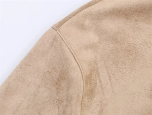 Detail shot of camel faux suede jacket shoulder with precise single-needle stitching