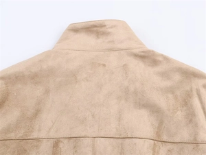Detail of faux suede jacket showing back collar stitching and fine brushed texture