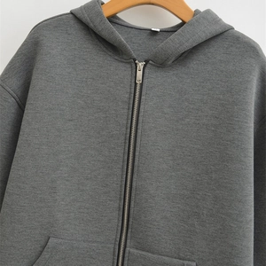 Women's oversized dark grey zip-up hoodie with drawstring hood and metal zipper