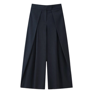 Detail view of high waist wide leg trousers with deep pleats and fine pinstripe pattern
