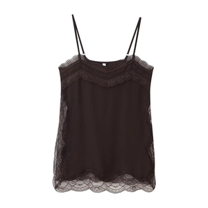 Detailed view of black lace trim and satin fabric on the slit camisole top