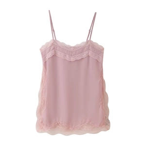 Detail of pink lace-trimmed camisole top showing the smooth satin fabric texture