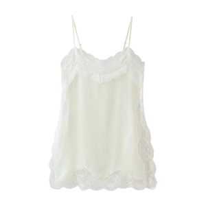 Close-up of delicate floral lace trim on ivory silk camisole top with v-neckline detail