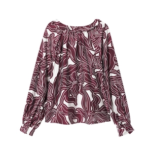 Women's ruffle neck long sleeve shirt featuring bold red and white floral art pattern