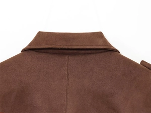 Detail of a brown faux suede jacket collar and shoulders with epaulettes and refined seams