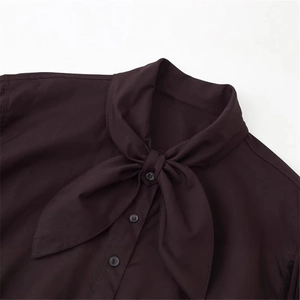 Deep burgundy pussy-bow poplin shirt featuring an elegant tie neck and button front