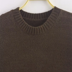 Classic dark brown crew neck knit sweater with ribbed collar and soft vintage texture