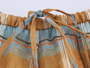 Detail of elastic waist with drawstring on retro striped ramie linen blend lantern pants