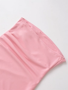 Detailed view of light pink pleated top featuring a seamless invisible zipper closure