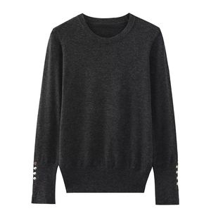 Dark grey crew neck knit sweater for women with decorative metal buttons on cuffs