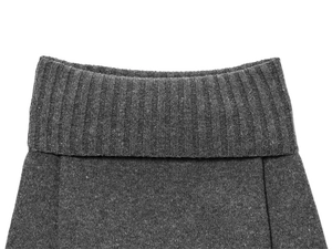 Detailed macro view of dark grey knit texture and ribbed collar on a casual sweater