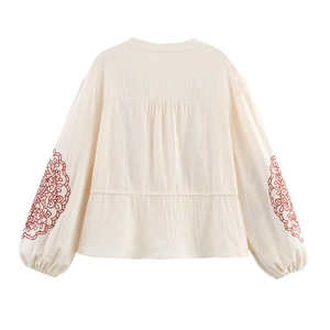 Ivory long-sleeve blouse with red floral embroidery on puff sleeves and round neckline