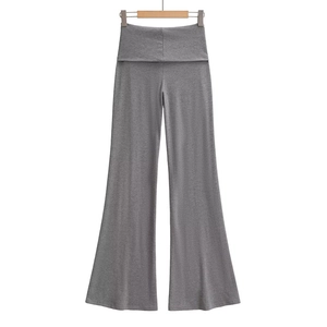 Detail view of dark gray high-waisted wide-leg knitted trousers with a fold-over waist band