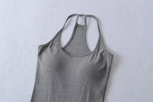 Detail of dark grey slim fit tank top with built-in padding and ribbed knit texture