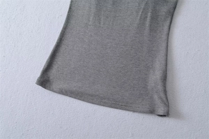 Detailed view of grey knitted top hem with precise double-needle stitching quality