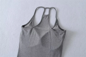 Detailed top view of grey slim fit ribbed tank top with cross back straps and built-in pads