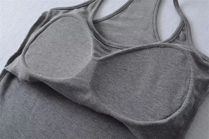 Detail of the gray knit vest interior showing integrated padding and seam stitching