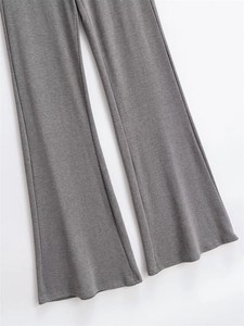 Detailed view of dark grey flare pants featuring high-quality knit fabric and clean stitching