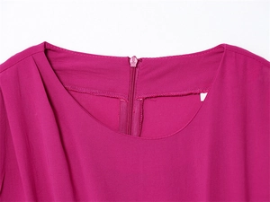 Close-up of crew neckline and back zipper detail on magenta sleeveless dress