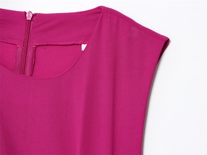 Detail of rose pink sleeveless dress neckline with neat stitching and back hidden zipper