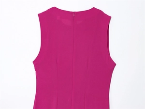 Detail of fuchsia sleeveless dress featuring back invisible zipper and fitted darts