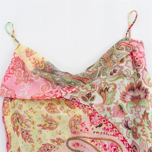 Bohemian floral patchwork slip dress with a draped neckline and thin straps in soft pastel