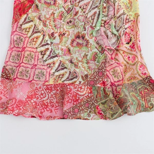 Detail of bohemian patchwork print with paisley and floral patterns on flowing fabric