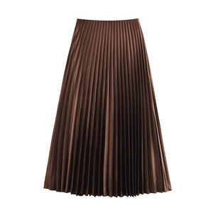 Close-up of fine pleats on brown satin A-line midi skirt with fluid drape texture