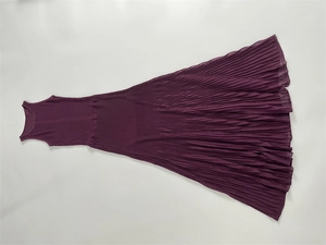 Detailed flat lay of a plum purple ribbed knit maxi dress with elegant pleated skirt