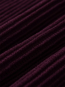 Detailed macro view of the premium burgundy ribbed knit fabric on a sleeveless maxi dress