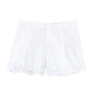 Elegant white cotton shorts with intricate eyelet flower embroidery and wavy scalloped hems