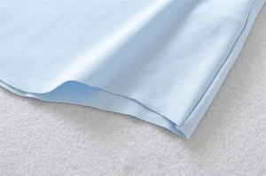 Detailed close-up showing the premium breathable knit texture of this white cotton t-shirt
