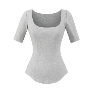 Detail of grey slim fit ribbed U-neck tee showing textured fabric and curved hem design