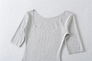 Detail shot of white square neck cotton T-shirt showing fabric texture and neckline