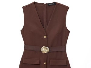 Detail of deep brown V-neck dress featuring golden flower buckle and matching belt