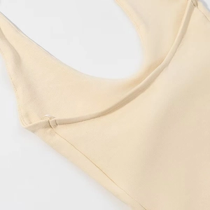 Detail of beige ribbed fabric with high elasticity and clean stitching on a halter top