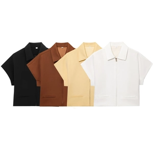 Detail of short-sleeve zipper jackets in black, brown, yellow and white with lapel collars