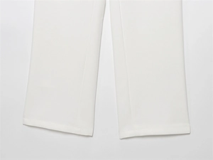 Detailed close-up showing the precise stitching and premium fabric of white trousers