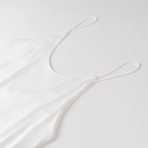 Elegant white satin dress with minimalist spaghetti straps and a smooth glossy finish