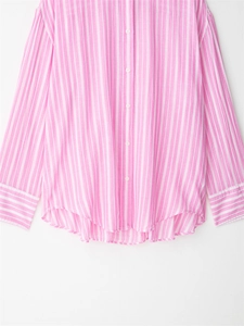 Detail of pink and white striped long-sleeve shirt with buttons and cuffs