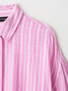 Close-up of pink and white striped shirt collar showing cotton linen fabric texture