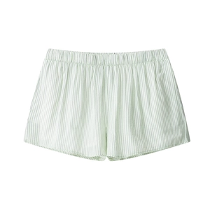 Detail of light green striped leisure shorts with elastic waistband for summer