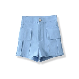 Detail of high-waisted light blue utility shorts featuring large cargo pockets and metal button