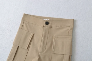 Detailed view of khaki high-waisted cargo shorts featuring functional utility pockets